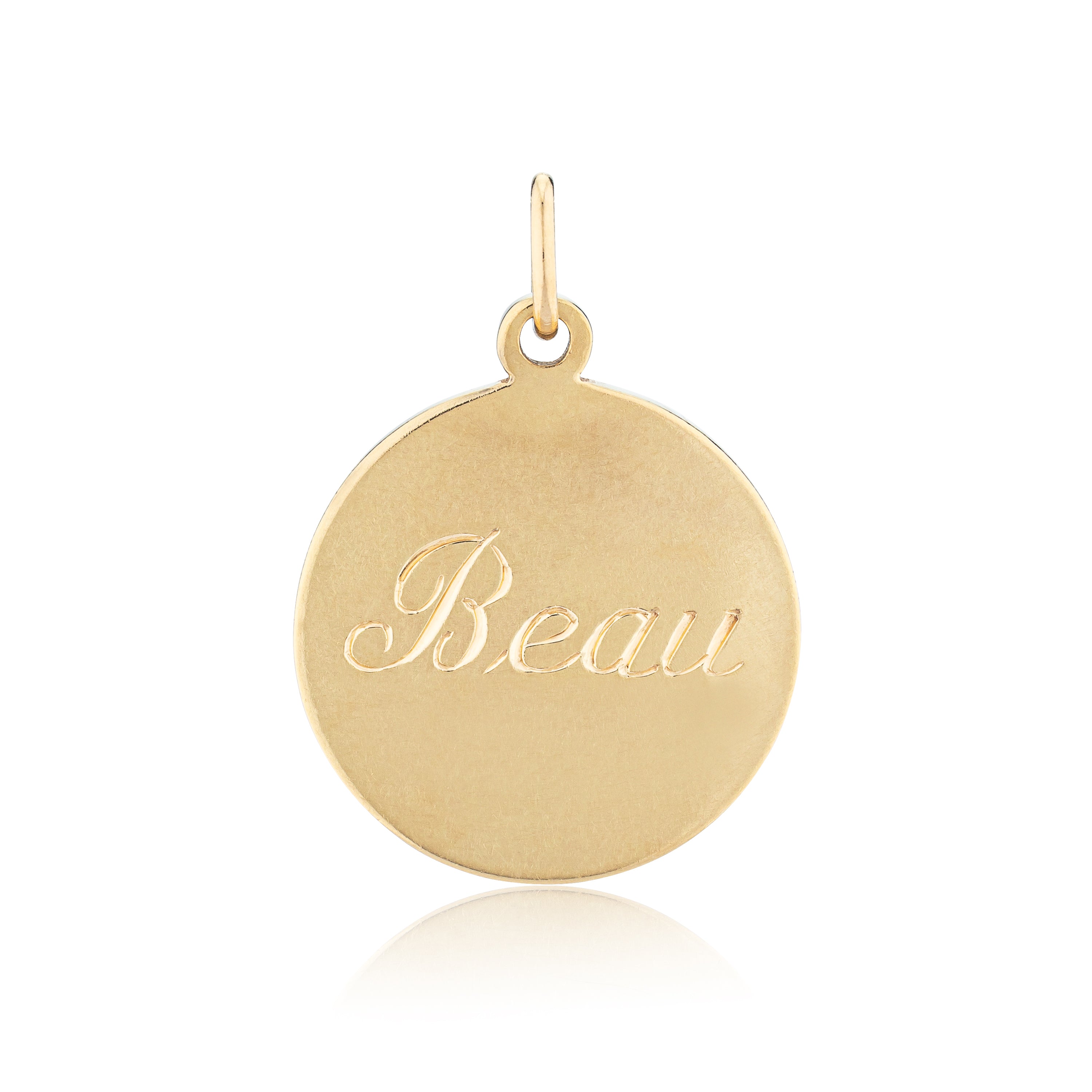 Gold pendant with 'Beau' engraved on a white background