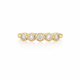 Gold ring with five diamonds on a white background