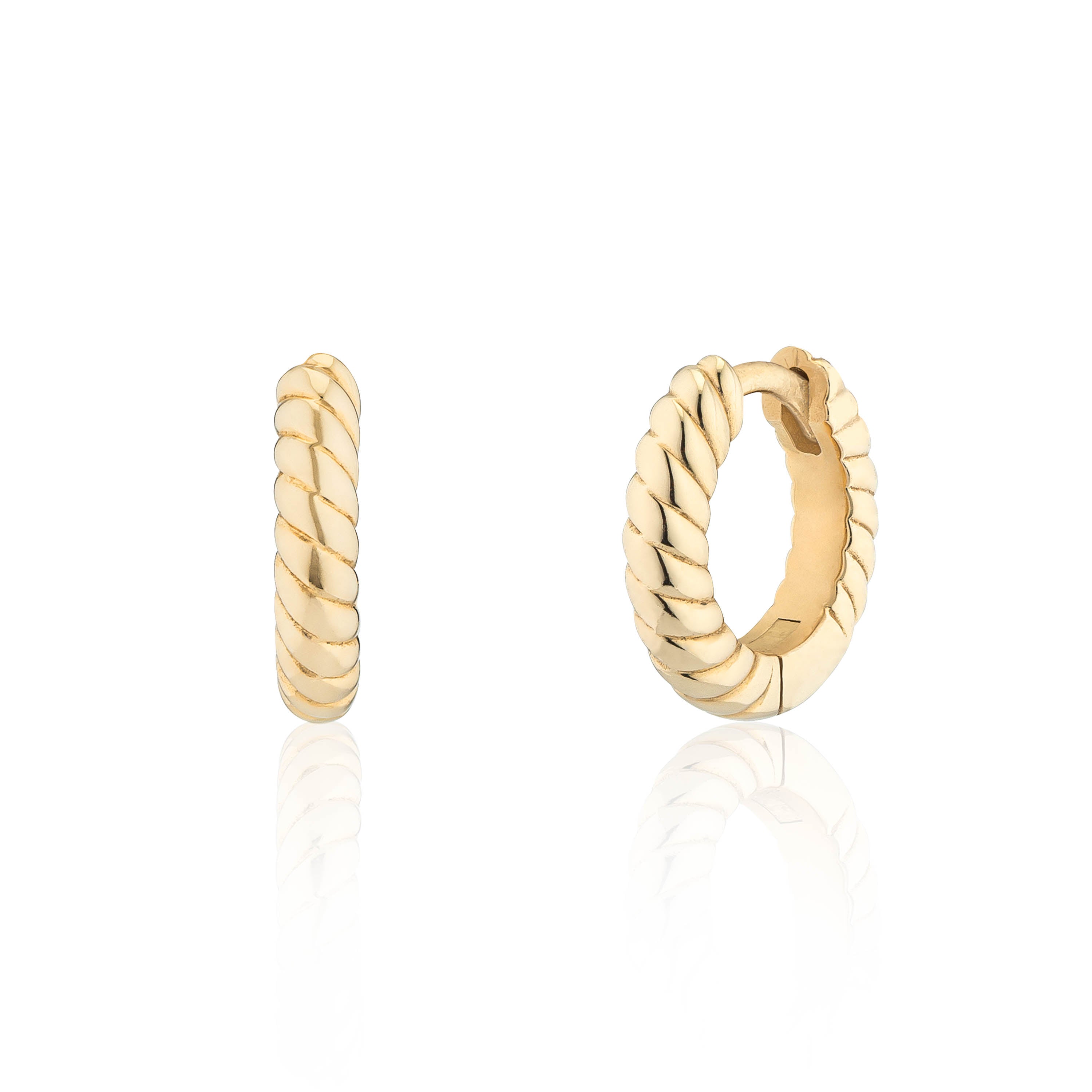 A pair of small gold huggie hoop earrings with a twisted rope texture, shown from the front and side on a reflective white surface.