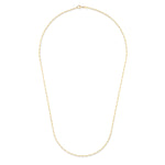 A delicate gold chain necklace arranged in an oval shape against a solid white background.