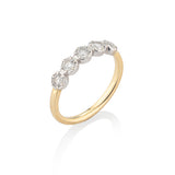 Gold ring with diamonds on a white background