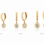  gold hoop and drop earrings with diamonds on a white background