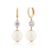 A pair of round white gold collet diamond and pearl earrings with a modern twist design.
