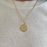 Engraved pendant on a dainty chain