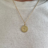 Engraved pendant on a dainty chain