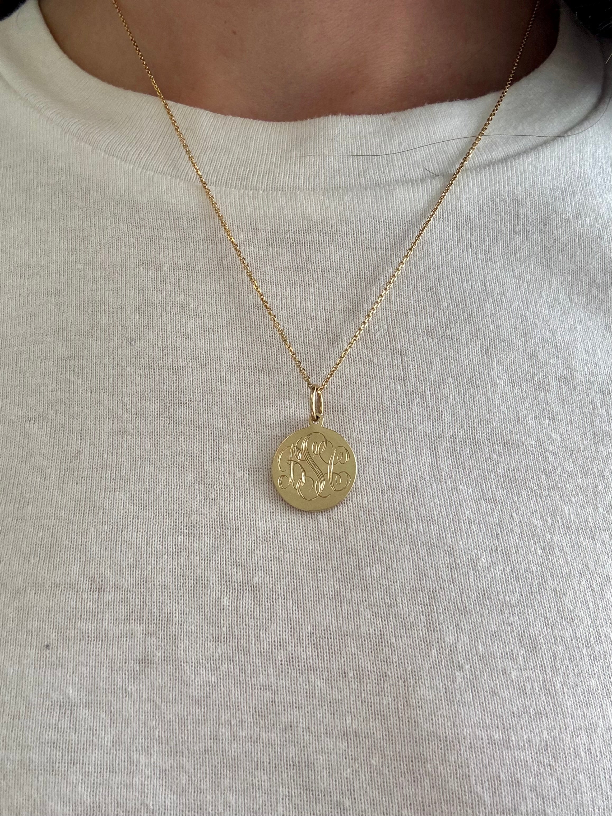 Engraved pendant on a dainty chain